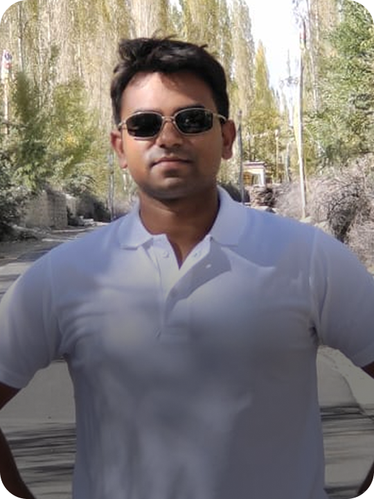 Bhupendra kumar wearing sunglasses and a white polo t-shirt outdoors with trees in the background